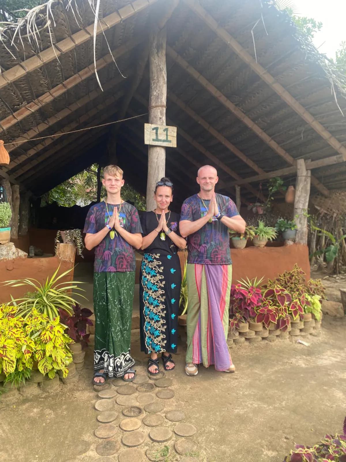 Travelers welcomed in traditional dress at a village stop in Sri Lanka